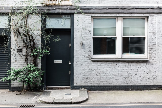 White double glazing windows near the main door