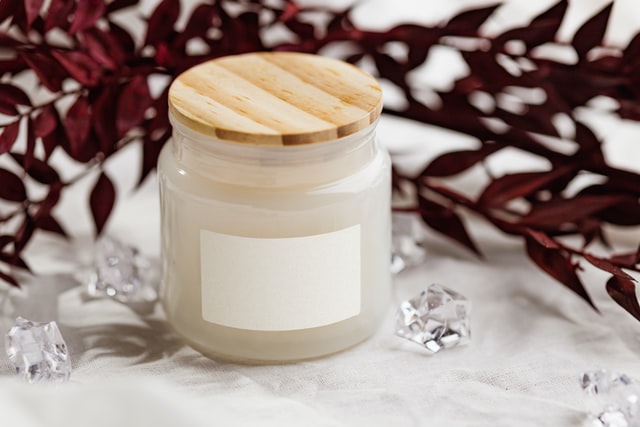 Small glass jar with a blank white label