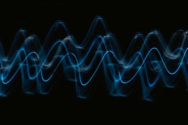 Sound waves highlighted in the dark black background